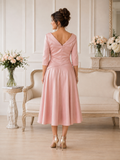 Back view of rose blush Ispirato dress showing V back neckline and A-line skirt
