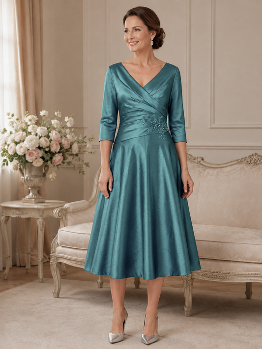 Ispirato ISH822 deep jade stretch taffeta mother of the bride dress on brunette model in elegant indoor setting