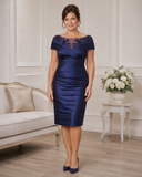 Ispirato ISJ817 midnight taffeta mother of the bride dress on brunette model in elegant indoor setting