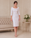 Soft pink brocade mother of the bride dress with ruched bodice, portrait neckline and three-quarter sleeves