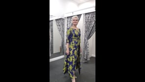 Occasions dress in royal and fern green with a fitted bodice, a slim skirt, and an overskirt, a perfect mother of the bride dress