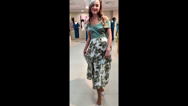 Video of full  Fil coupé botanical skirted dress in sage tones.