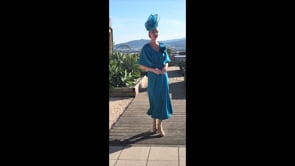 Video of soft floaty summer mother of the bride dress in tiffany blue.
