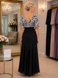 Back view of Lewis Henry black and ivory formal gown featuring elegant V back and flowing bias cut silhouette