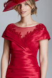 Red satin formal dress with floral applique, elegant woman in red hat